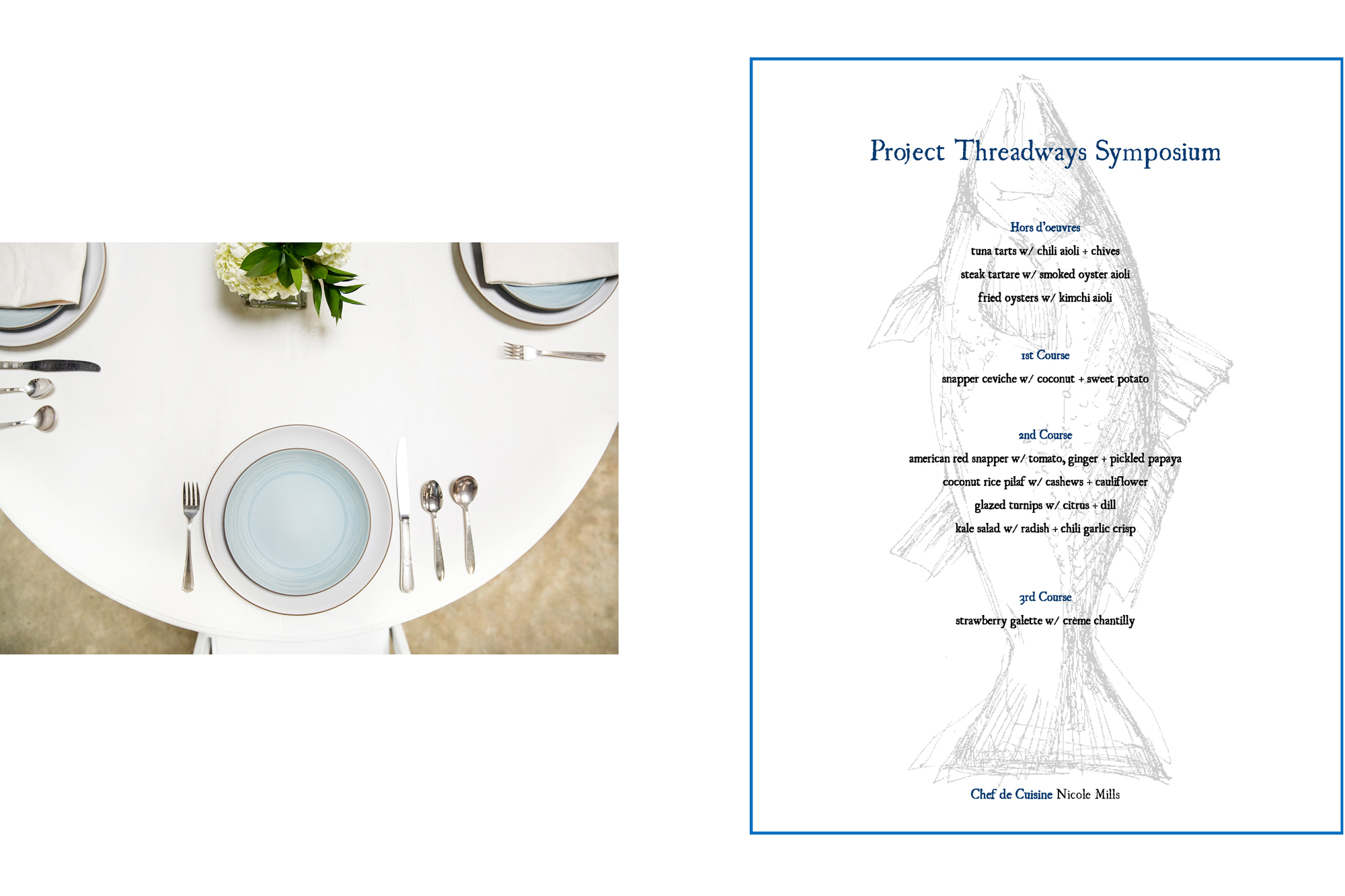 Table setting with blue and white plates along with an image of a dinner menu.